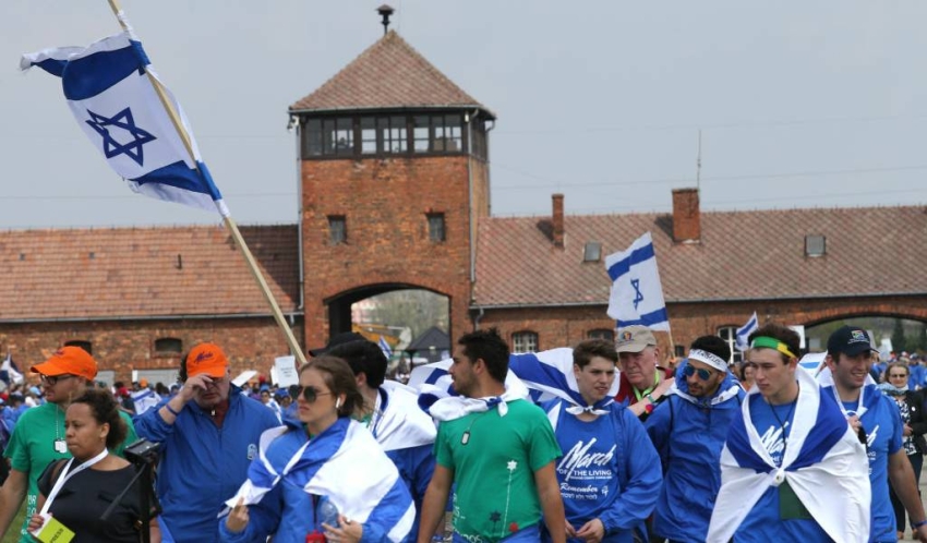 Students seen walking with Israeli flags during the March of