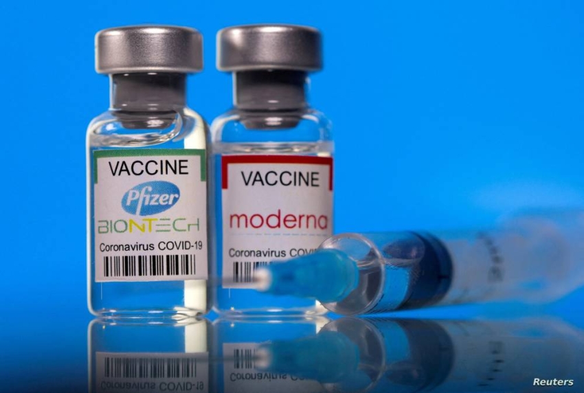 FILE PHOTO: Picture illustration of vials with Pfizer-BioNTech and Moderna coronavirus disease (COVID-19) vaccine labels